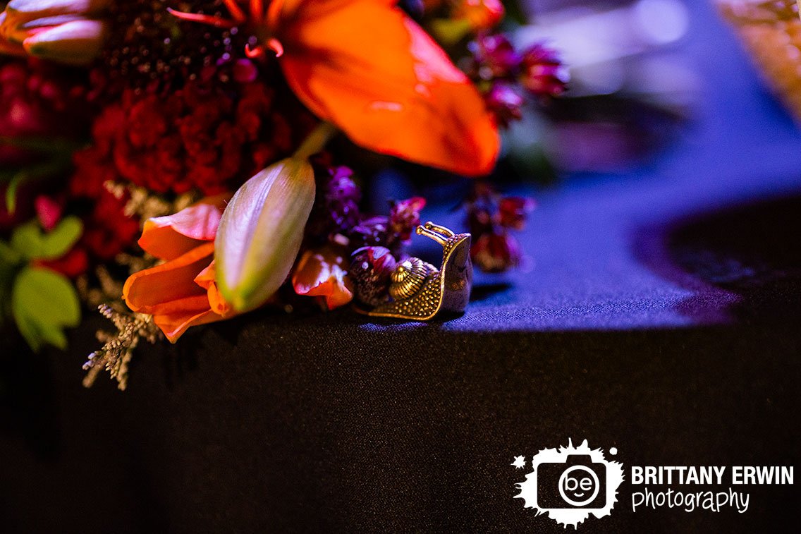 metal-snail-figure-at-head-table-wedding-photographer.jpg