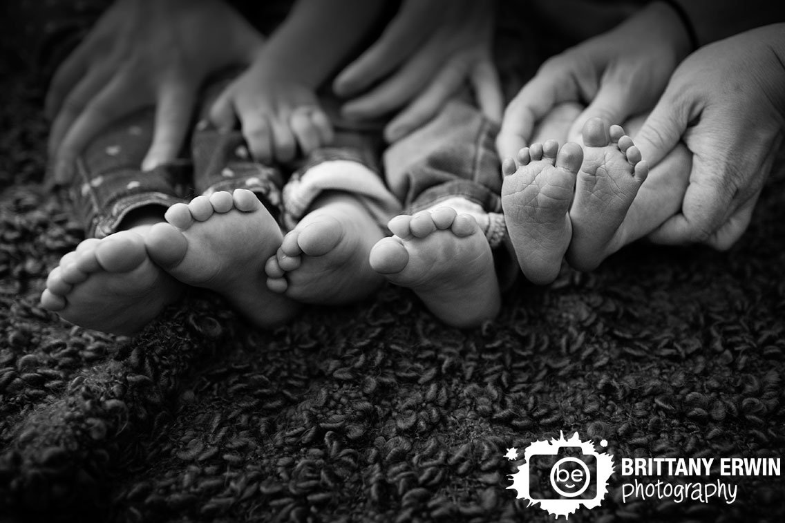 Indianapolis-portrait-photographer-siblings-portrait-of-feet-together-textured-blanket.jpg