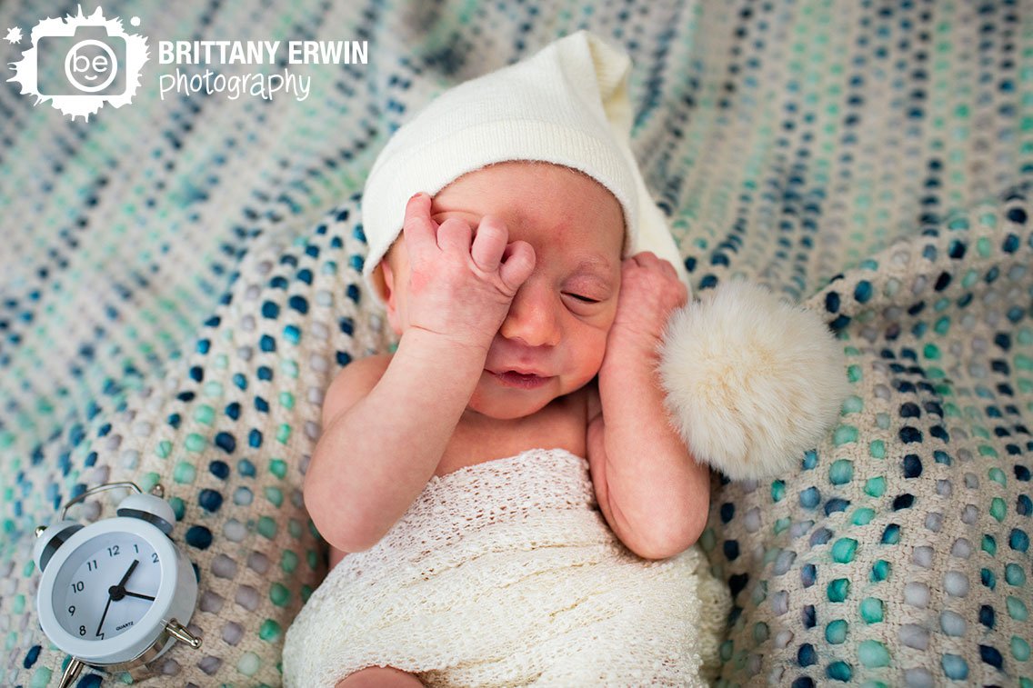 Indianapolis-in-home-lifestyle-newborn-photographer-baby-boy-waking-with-alarm-clock.jpg