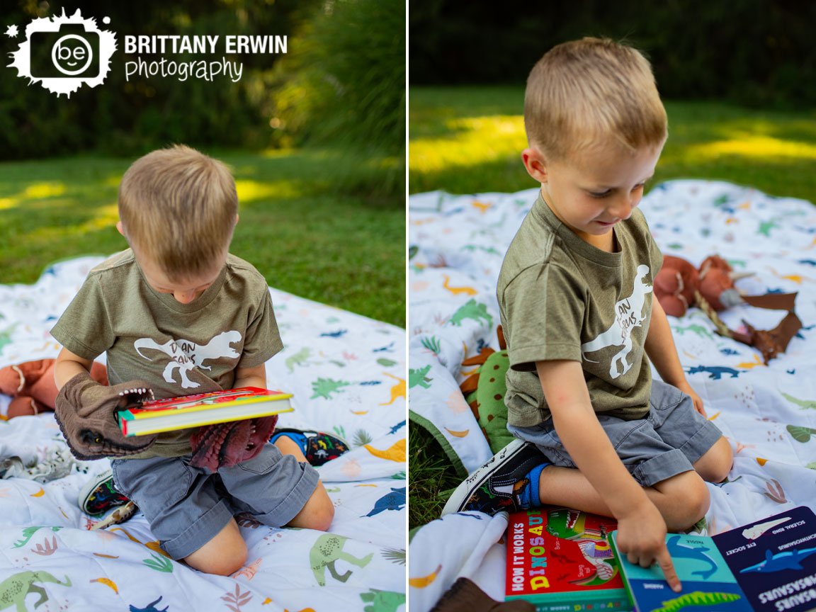 boy-with-dinosaur-puppet-hands-reading-book-on-dino-blanket.jpg