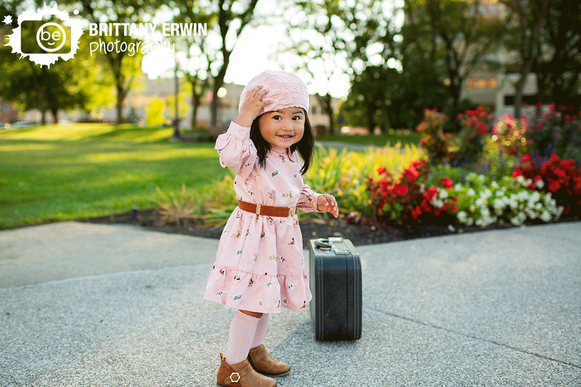 Downtown-Indianapolis-first-birthday-photographer-girl-with-pink-crochet-hat-outside.gif