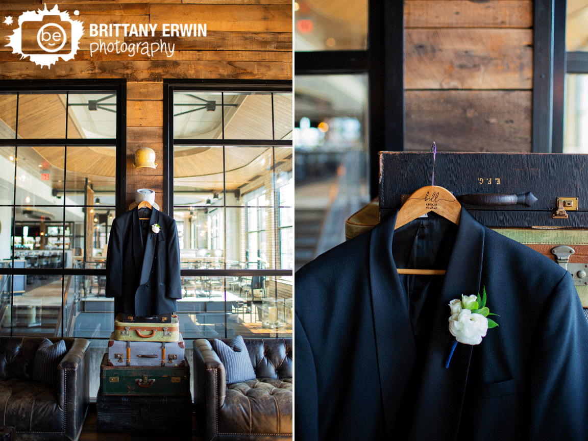 groom-suit-hanging-from-old-suitcases-detail-photo.gif