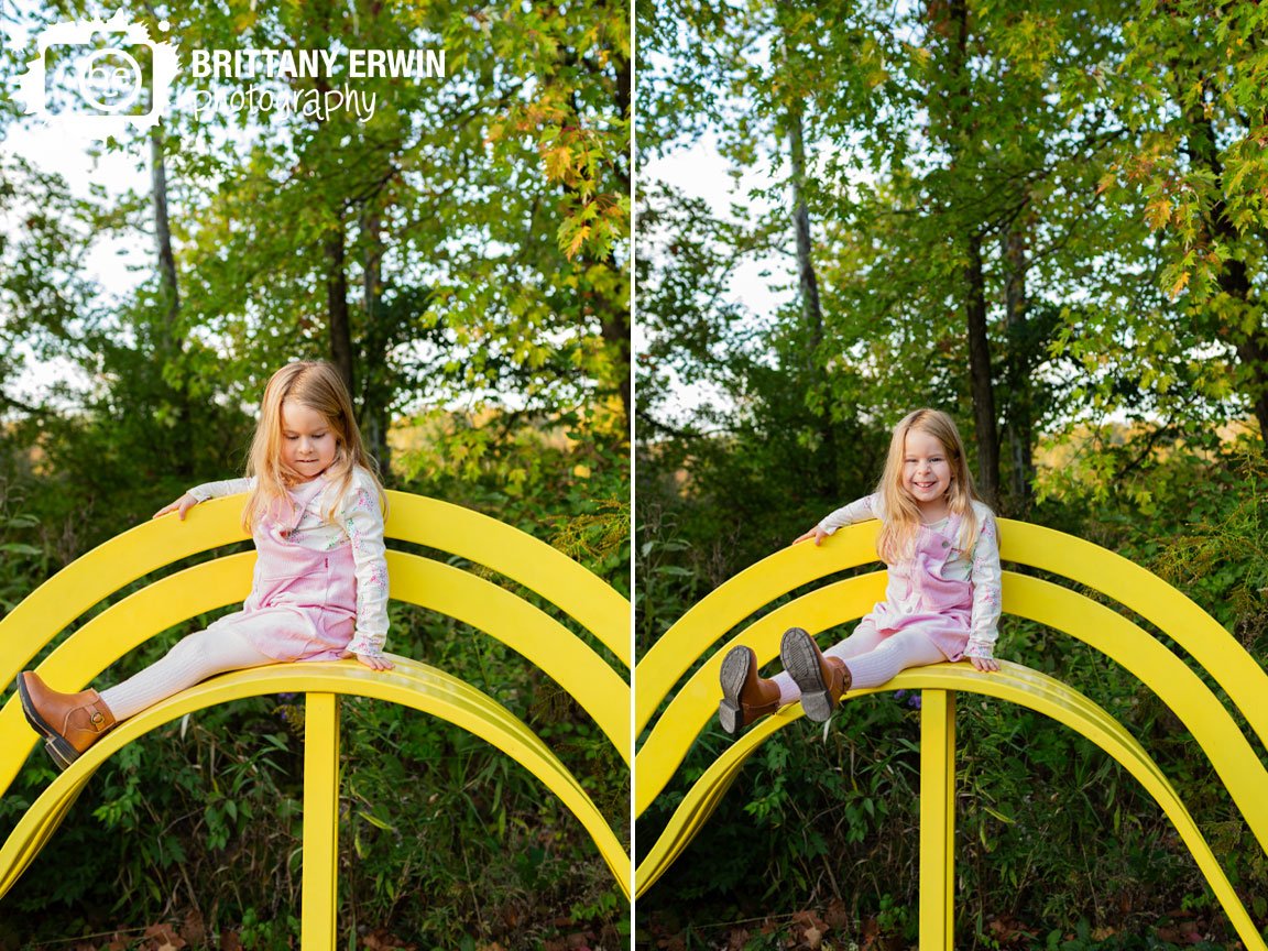 Indianapolis-portrait-photographer-girl-playing-on-large-yellow-bench-playground.jpg