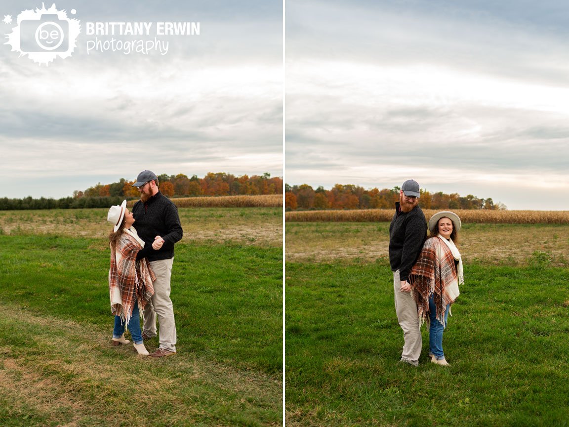 couple-dancing-in-field-at-sunset-fall-engagement.jpg