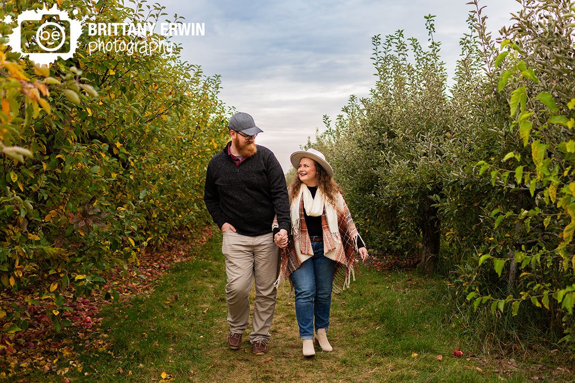 Indiana-Tuttle-Orchard-engagment-portrait-couple-between-apple-trees.jpg