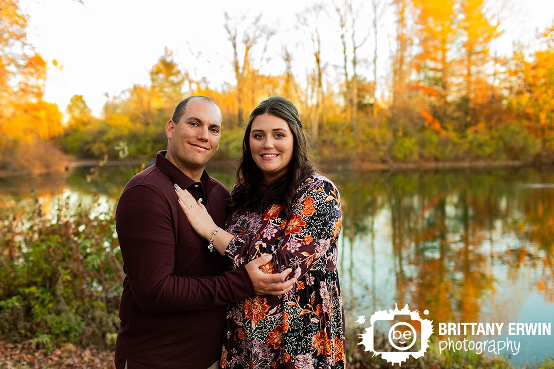 Fall-Engagement-portrait-photographer-couple-by-pond.jpg
