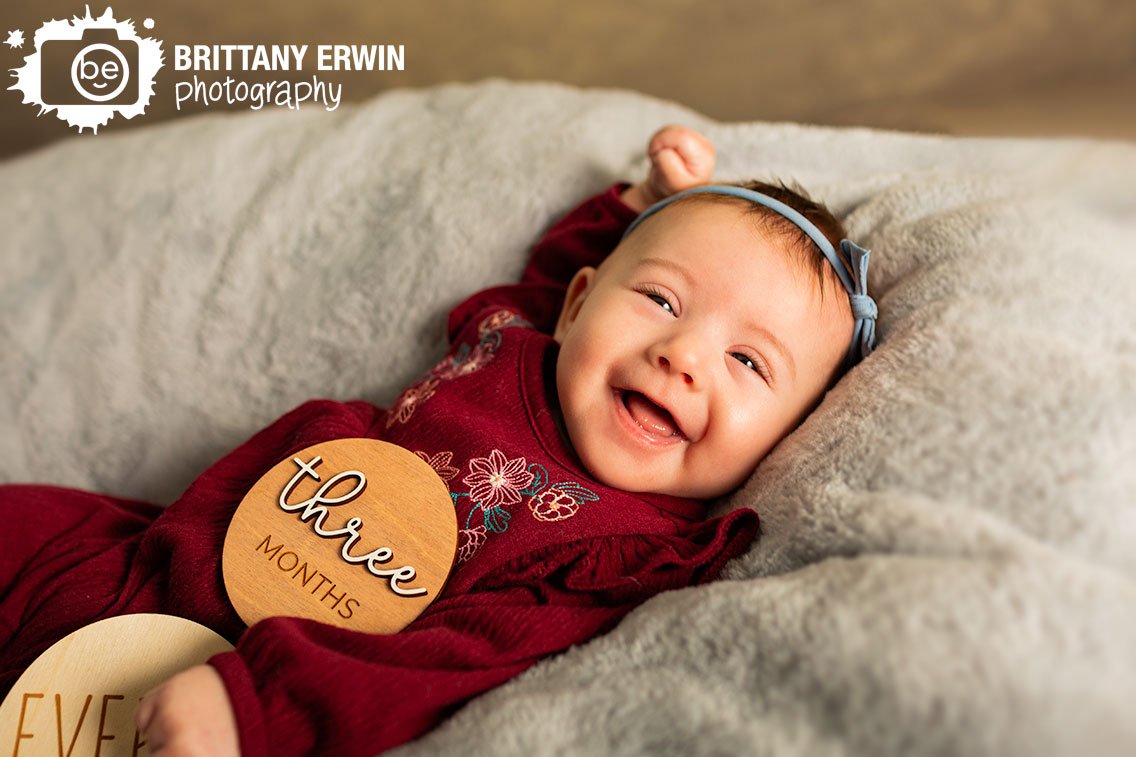 Indianapolis-studio-portrait-milestone-photographer-baby-girl-smile-on-soft-blanket.jpg