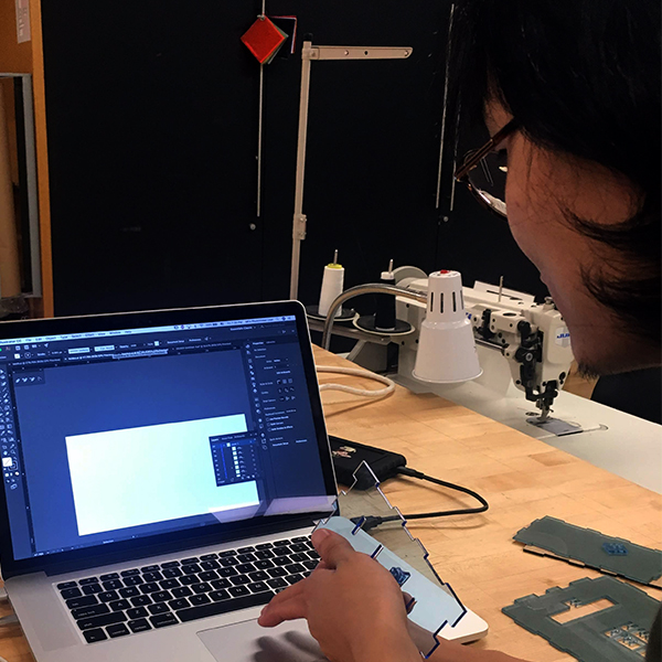 Lili Zhang from MFA Photo, Video, and Related Media works on a laser cutter file for an assignment for the Photo, Video, and Related Media class taught by former VFL Staff member Tak Cheung.