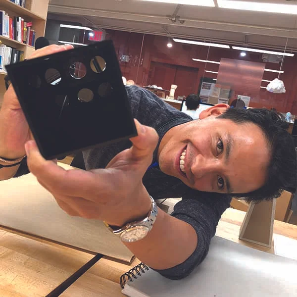 He made a slide-viewer with varied materials such as acrylic and wood.