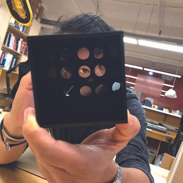 Shown here is a glimpse of him playing with the kaleidoscope-like imagery caused by the shining acrylic surfaces.