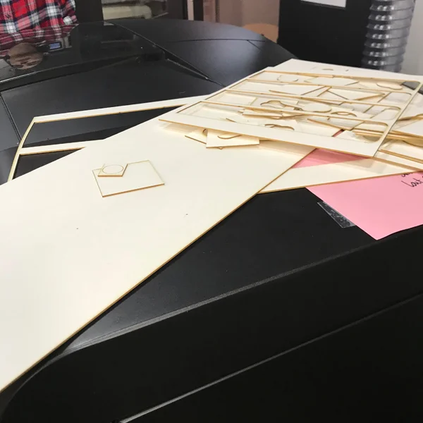 Instead of configuring the machine for etch and cut in the same job, separate your work on to two layers - a cut layer and an etching layer. Make sure all of your lines are set to 0.001". Hide the cut layer and go to the print settings, now instead of putting in the etching settings choose vector and set it the same way you would to cut. Make sure to lower the power. Hit print - you've just tricked the laser into etching you material much faster than it wants to.