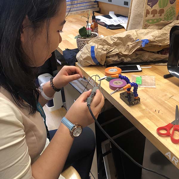 Leng, Sherry, and Anna of Products of Design MFA are working on a Halloween costume for their Making Studio class. For this class, they are sewing together an adorable pink penguin which they’ll embed an interactive circuit with Arduino and LEDs.