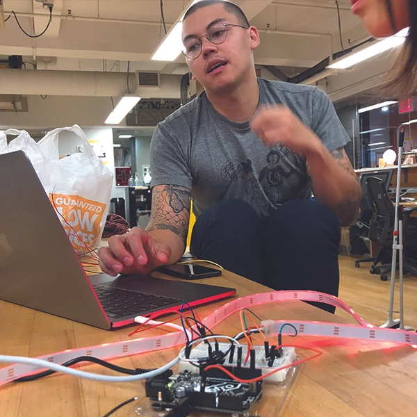 Together, they were troubleshooting some code for an arduino for their "Making Studio" class. After spending 2 hours debugging, they finally reached the solution.