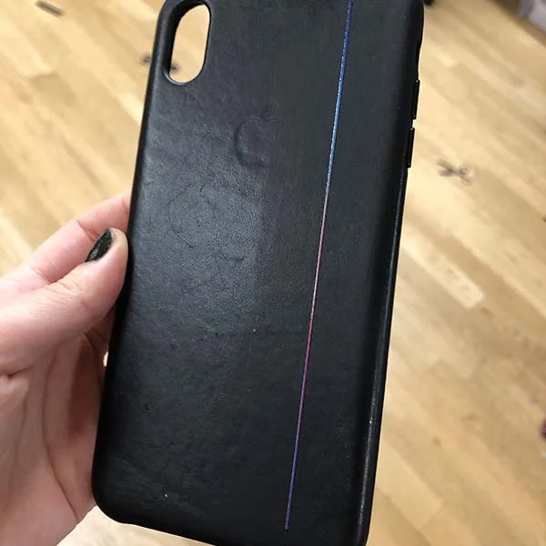 After some tweaks, she printed onto a leather iPhone case a gradient bar that is comprised of three layers. White to make the colors pop, CMYK for the image, and a layer of gloss to top it off