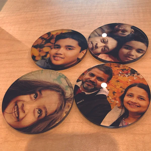 Student staff workers exploring the Laser Cutter and UV printer to make Thanksgiving gifts. Abhinav from MFA Interaction Design made these coasters to give to his family members on Thanksgiving.