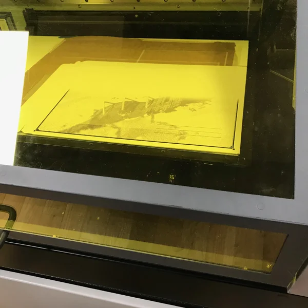Trial and error is an important part of design and the VFL is here to help. We recently helped MFA Photo, Video, and Related Media student Petros Lales figure out the best way to get his artwork on envelopes that will be sent to customers who purchased a game he created. At first we tried engraving the image using the laser cutter and then on moved on to the UV printer.