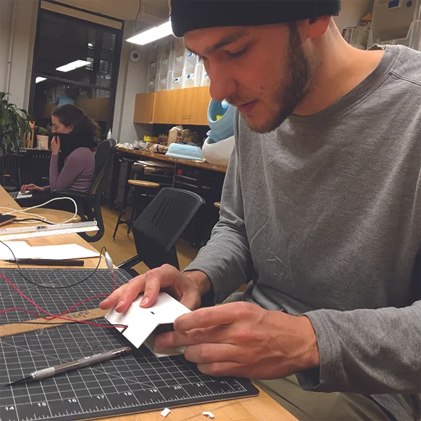 MFA Products of Design First Year student and VFL Student worker Weston Rivell is working on a case for his Arduino prototype using matboard.
