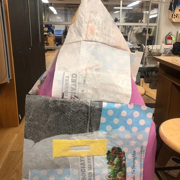 Chenwei Xu is a MFA Design student that is working on a project for Design Decisions. She is fusing layers of plastic bags together using an iron to create fabric and then sewing them together. 