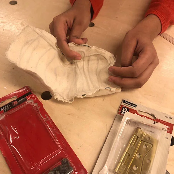 She is making a malleable chair for women experiencing pain in the workplace. She’s currently working on a wooden frame for an early prototype.