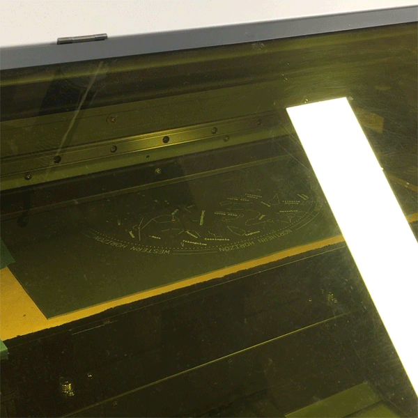 This evening, 2nd-year MFA Products of Design student John Boran used the UV printer to lay down the delicate white graphics of a star map onto a laser cut sheet of blue card stock.