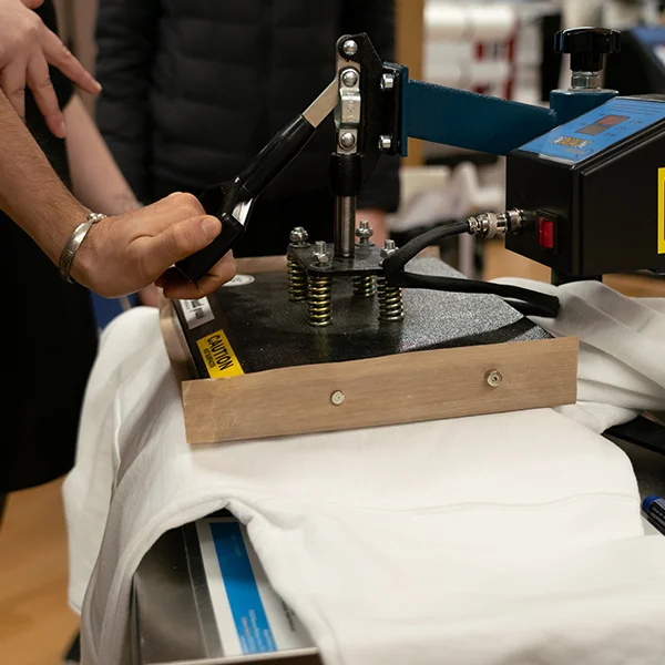 Printing with the high-resolution Roland VersaCAMM on heat transfer media and using the heat press to transfer it on your fabric, you can make custom products all day long.