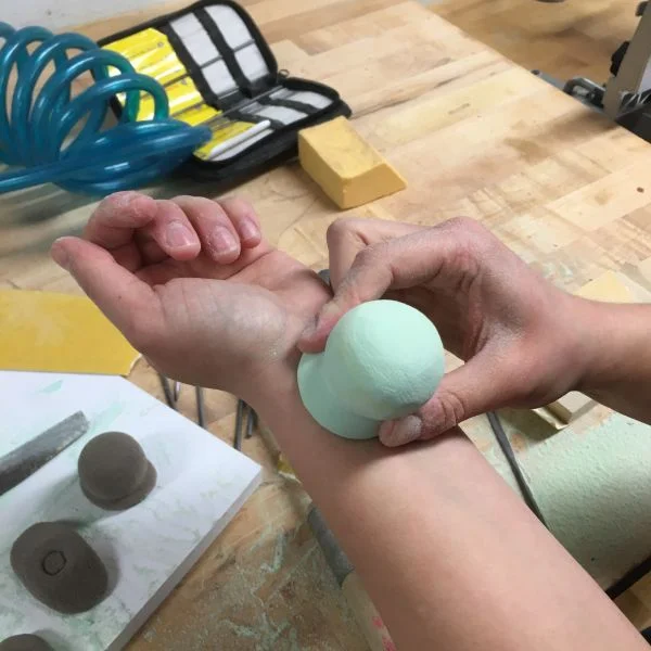 Its designed to do this because research has shown that when people are aware of their own pulse, their emotional intelligence increases. She is using foam and shaping it using the bandsaw and sanding blocks to explore different forms.