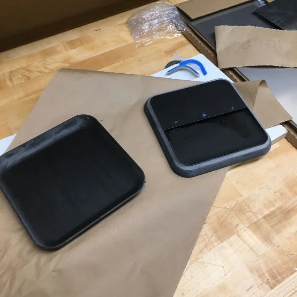 Next he'll be wrapping it in fabric. The top and bottom pieces were printed on the Objet , where he made full use of the multimaterial settings using black and transparent resin.