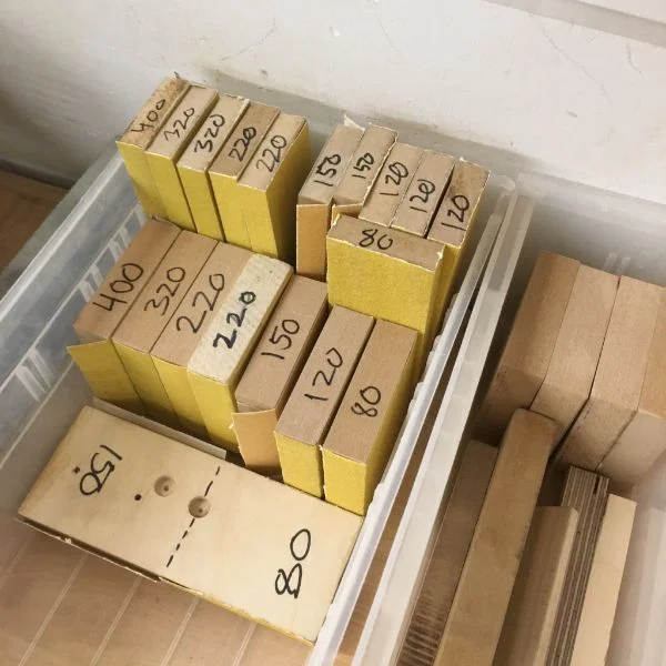 Shop worker and MFA Products of Design first year student Wes tackled the sanding block situation today. He cut new blocks on the table saw from some scrap and provided multiples of each grit in two different form factors to make sure when the shop is busy there will still be plenty of prepped blocks to go around.