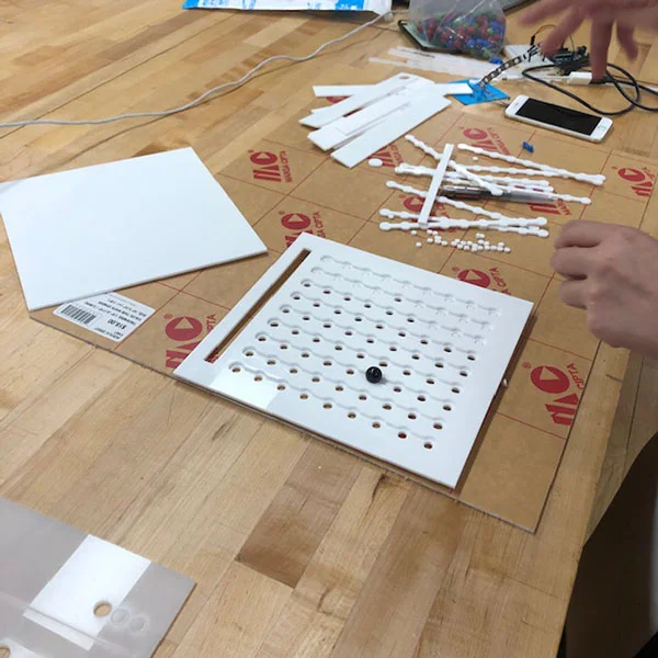 Underneath the laser cut board, there will be LEDs that light up when the game is complete.