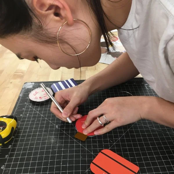 She used a combination of the vinyl plotter and UV printer to put faces and labels on everything. The game is called happily ever after and its the relationship version of the game of life. The idea is to educate people about different relationships in a fun and engaging way.