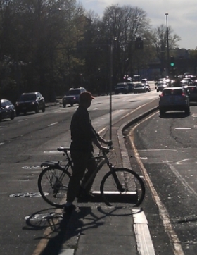 The cut-through made it easier to get from one side of the road to the other, but people on bikes didn't have protection from oncoming traffic. Photo courtesy of Calm Streets Boston