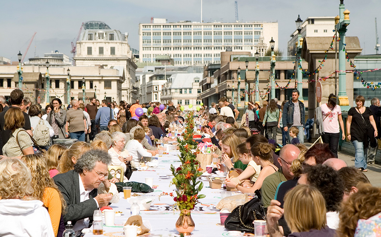 Attendees at a London festival enjoying a meal made entirely of discarded food.