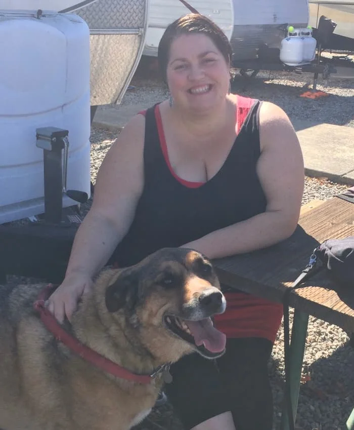Claudette with her beloved Dilly after healing from her back sprain (without weight loss.)