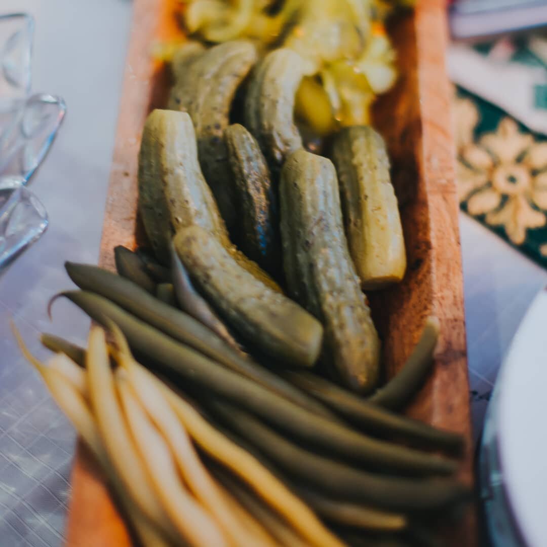 Pickling is a great way to preserve vegetables of all varieties.  Here we have pickled green and yellow beans, gherkins and bread &amp; butter pickles in the back. I think there's even pickled asparagus on this tray but you can't see them in this pho