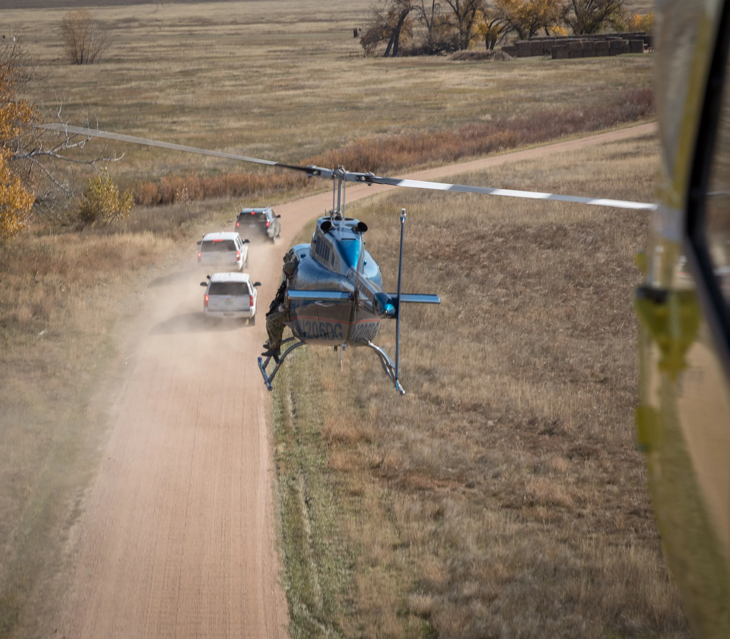 In this photo I used a shutter speed of 1/320. You will notice the tail rotor is still in full "motion" while the main rotor is almost stopped (because the tail rotor spins much faster). In addition a little bit of the ground and cars are blurry because the 1/320 wasn't quite fast enough to capture the motion of everything. I should have probably bumped this shutter speed up to 1/500 to get a crisper shot. Canon 5D Mark IV, 24-105mm | f/9, 1/320, ISO 200