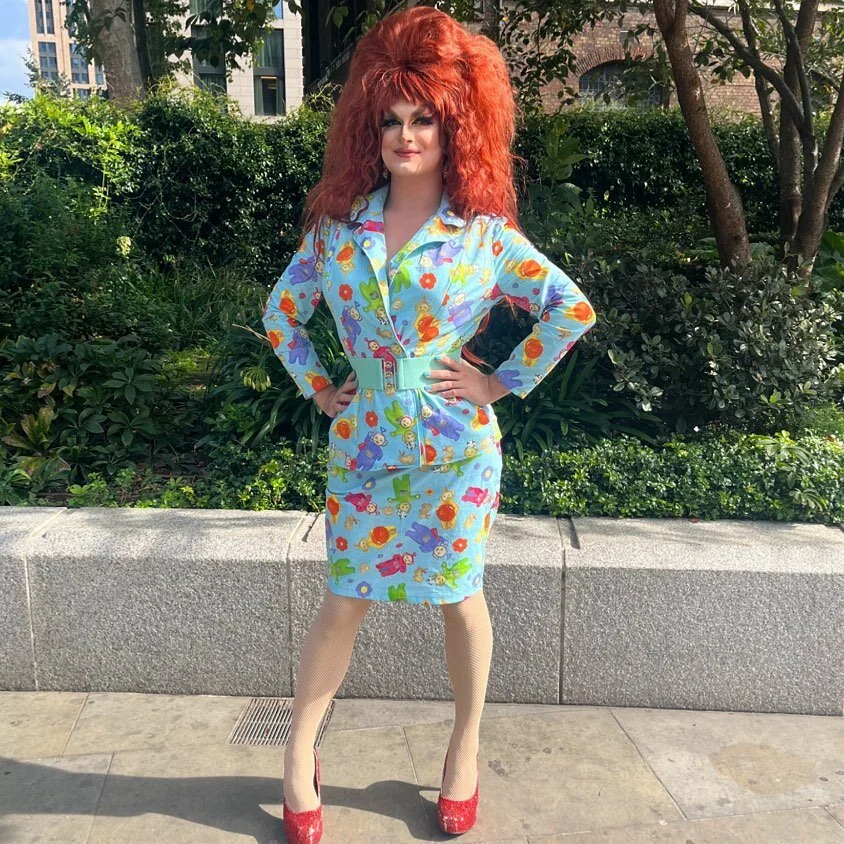 You had me at &lsquo;eh-oh&rsquo;

ID: Kate stands in a skirt suit made out of a pair of Teletubbies curtains, featuring the classic four icons, some rabbits, flowers and tubby toast. Tubby custard comes later.