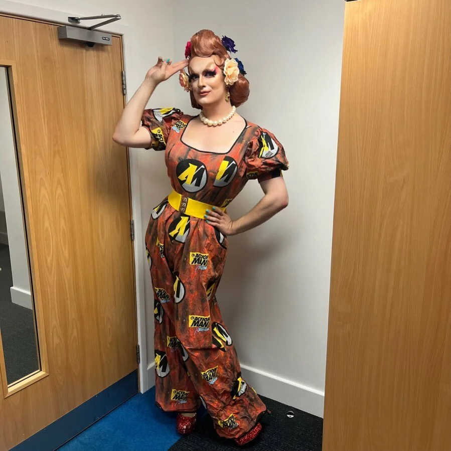 it&rsquo;s ironic

ID: Kate stands in a jumpsuit made from copper curtains featuring the logo for Action Man repeated over and over. She&rsquo;s doing a salute to the downfall of society xx

#dragqueen #drag #actionman