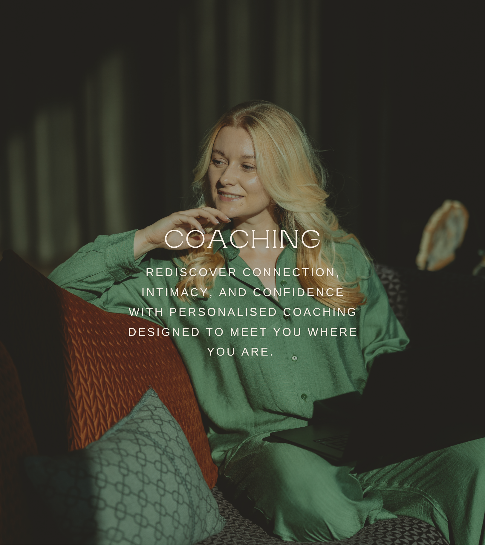 A woman with blonde hair sitting on a couch with cushions, working on a laptop, with a handwritten note in the background and overlay text about coaching services.