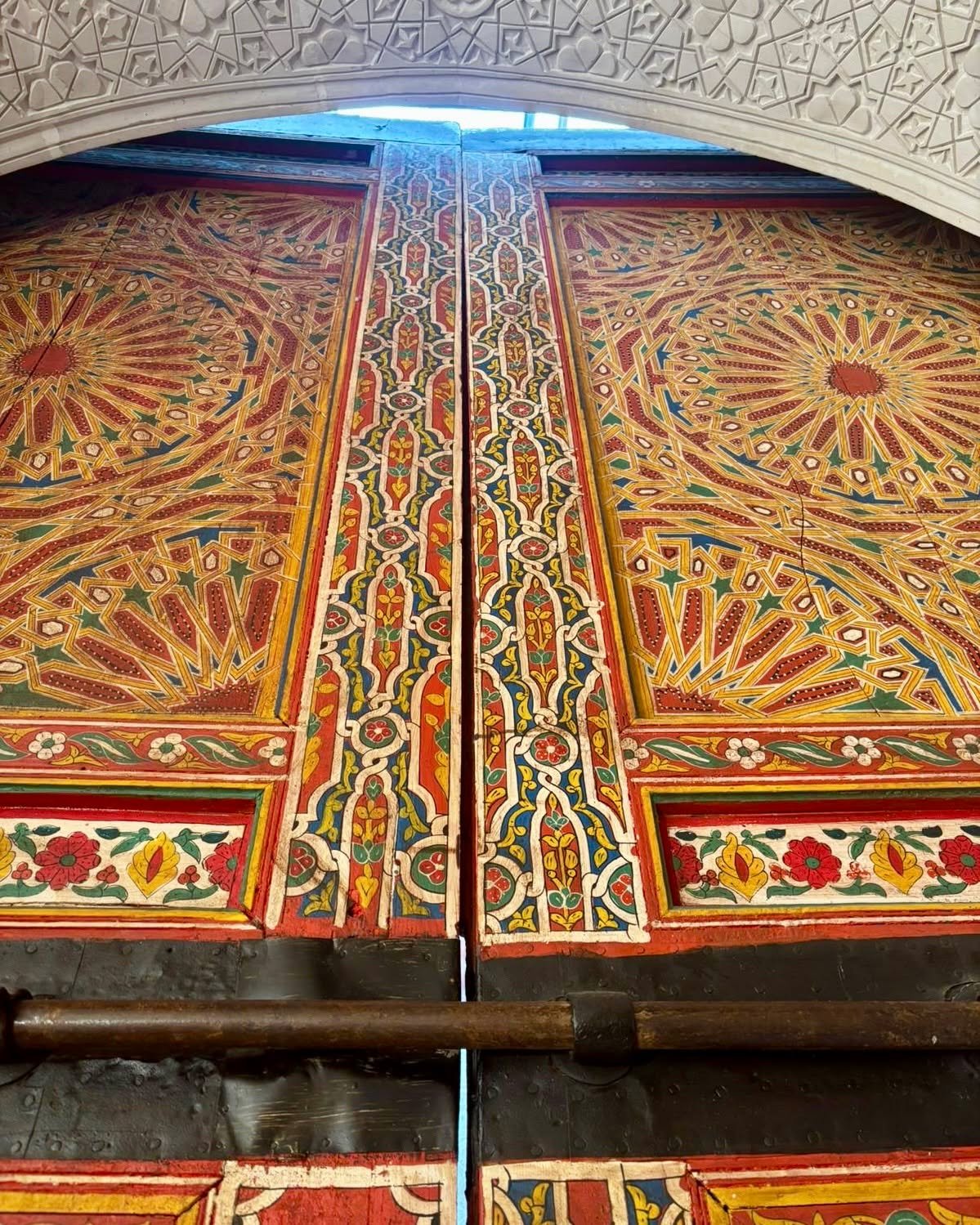 Carved wood, painted by hand.
Fez craftmanship at Dar 7 Louyat