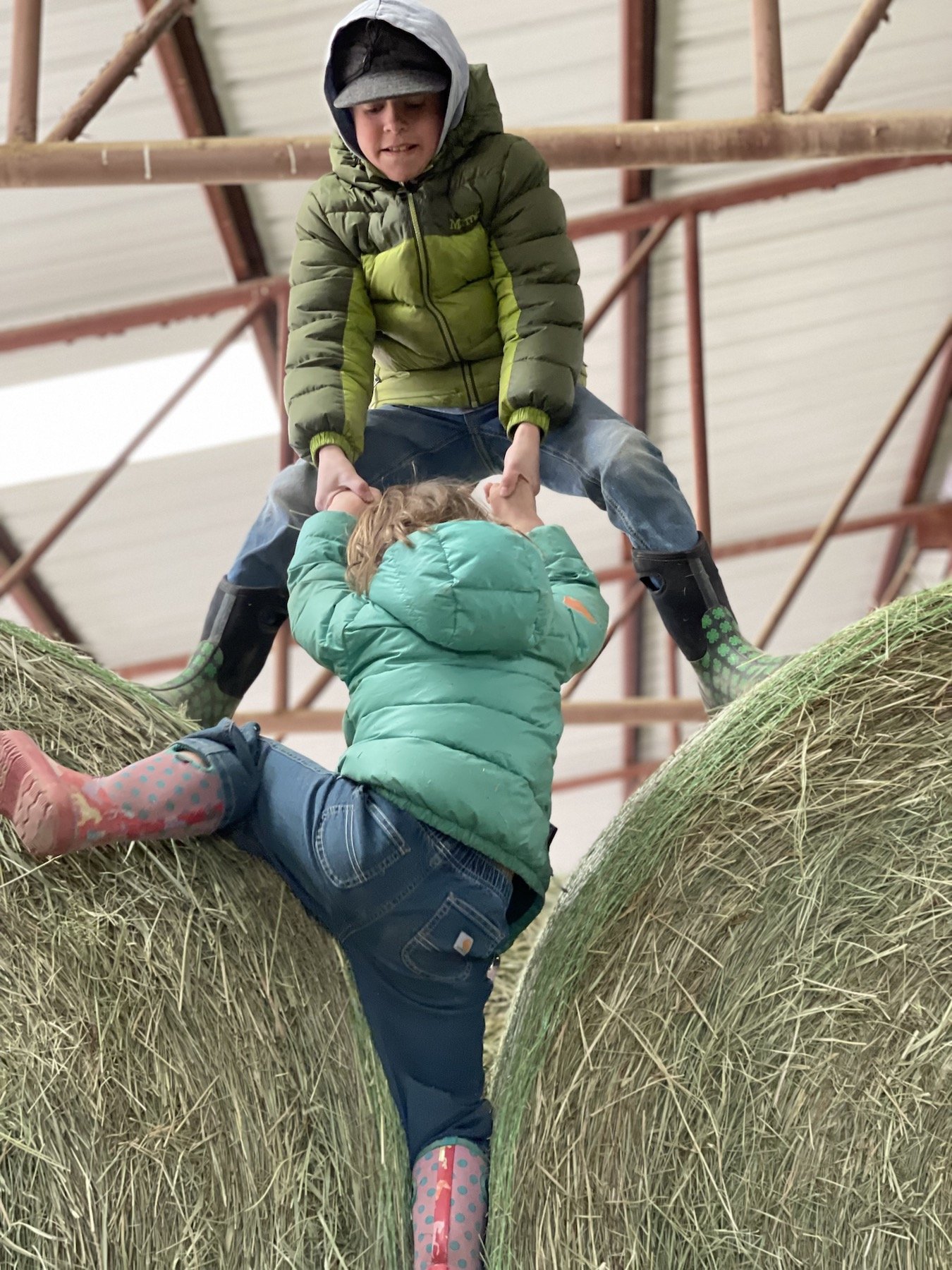 climbing hay bales.jpeg