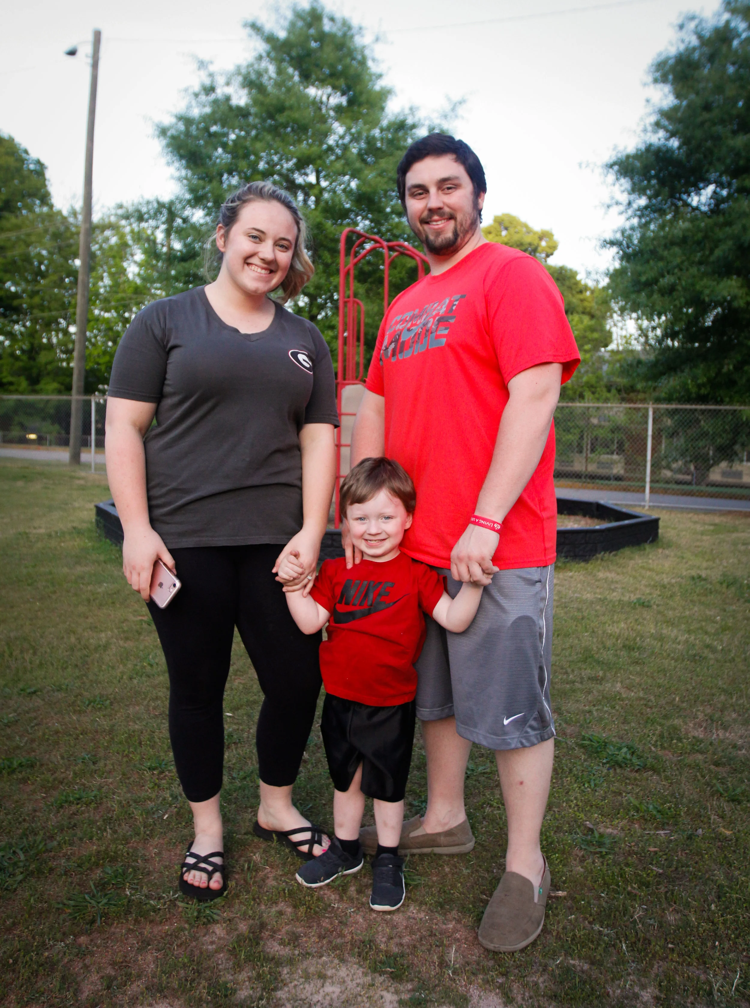 Spencer Hogg, a senior at the University of Georgia, and Taylor Smith, a junior at the university of Georgia, pose for a portrait with their son Branson on April 4, 2017 in Athens, Georgia. 