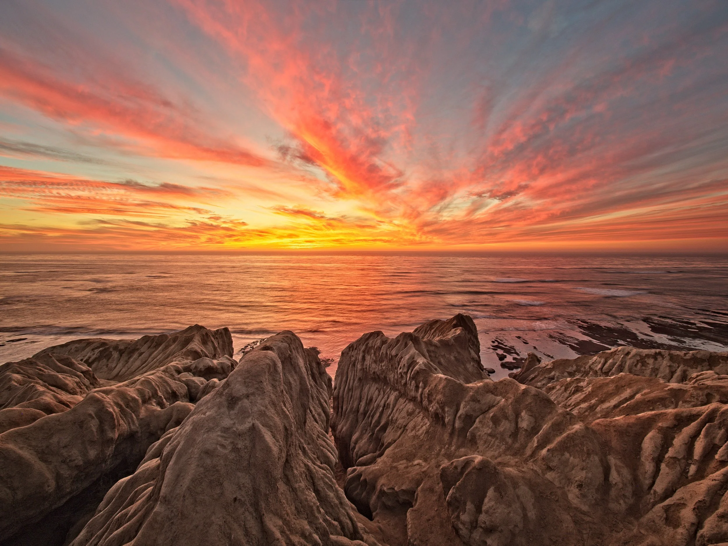 The eroded cliffs make a unique foreground element