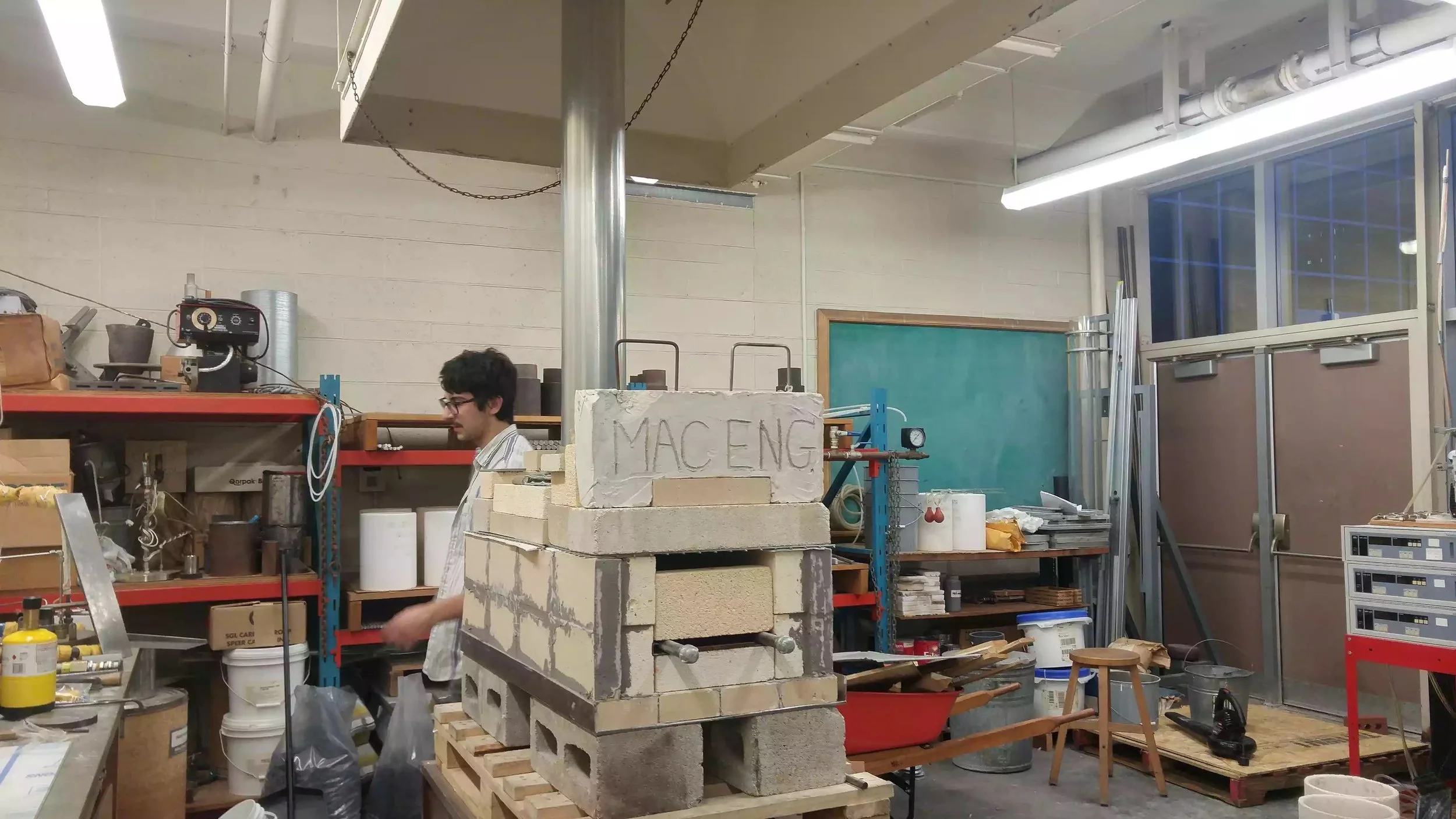 Full view of the finished furnace with the chimney connecting to the fume-hood.