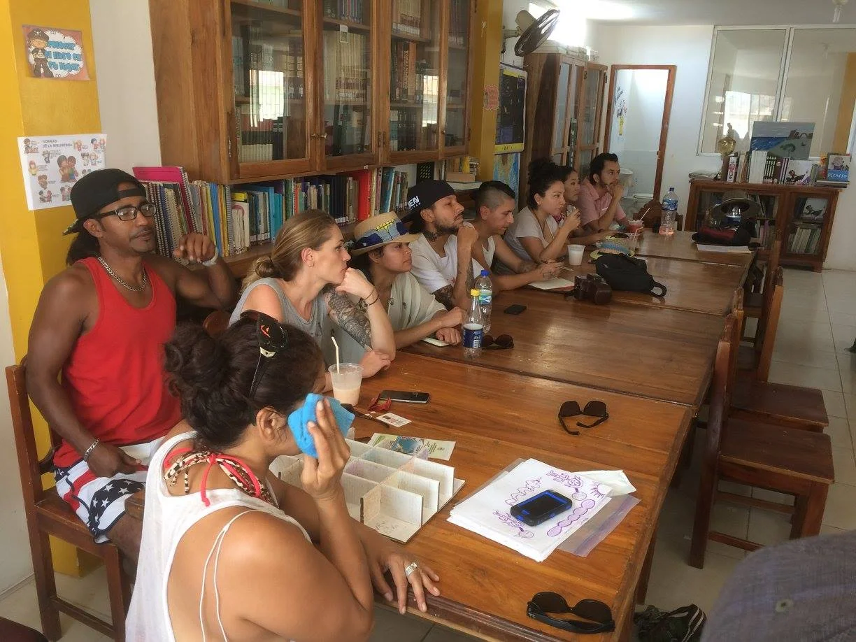 Artists attend a lecture about the history and culture of Manabí and the Jama Cuaque before beginning their murals.