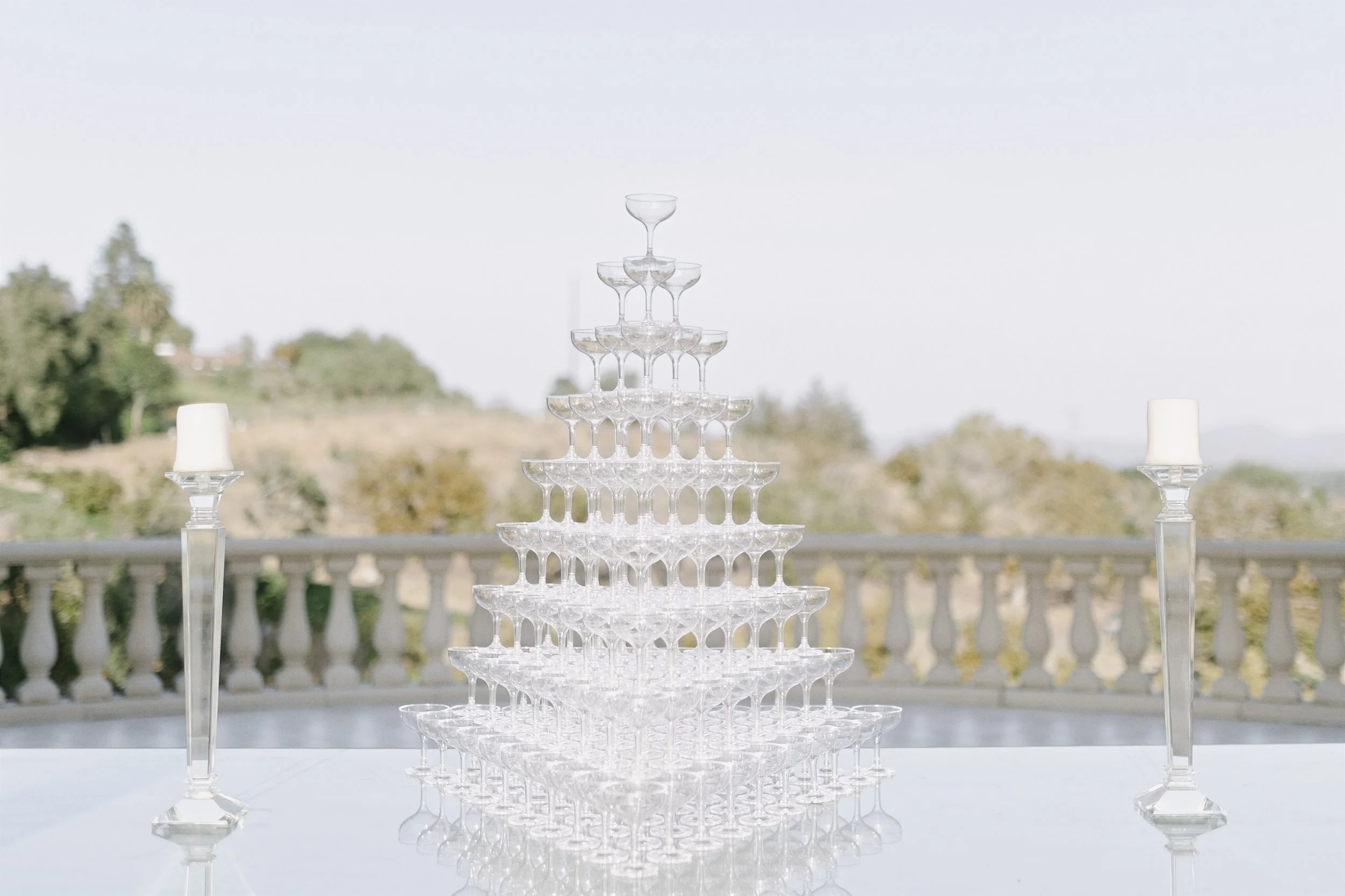 Chrystal tower of champagne glasses piled into a triangular tower for the wedding toast for the welcome speeches built by Los Angeles Top Planner Michele Fox Gott
