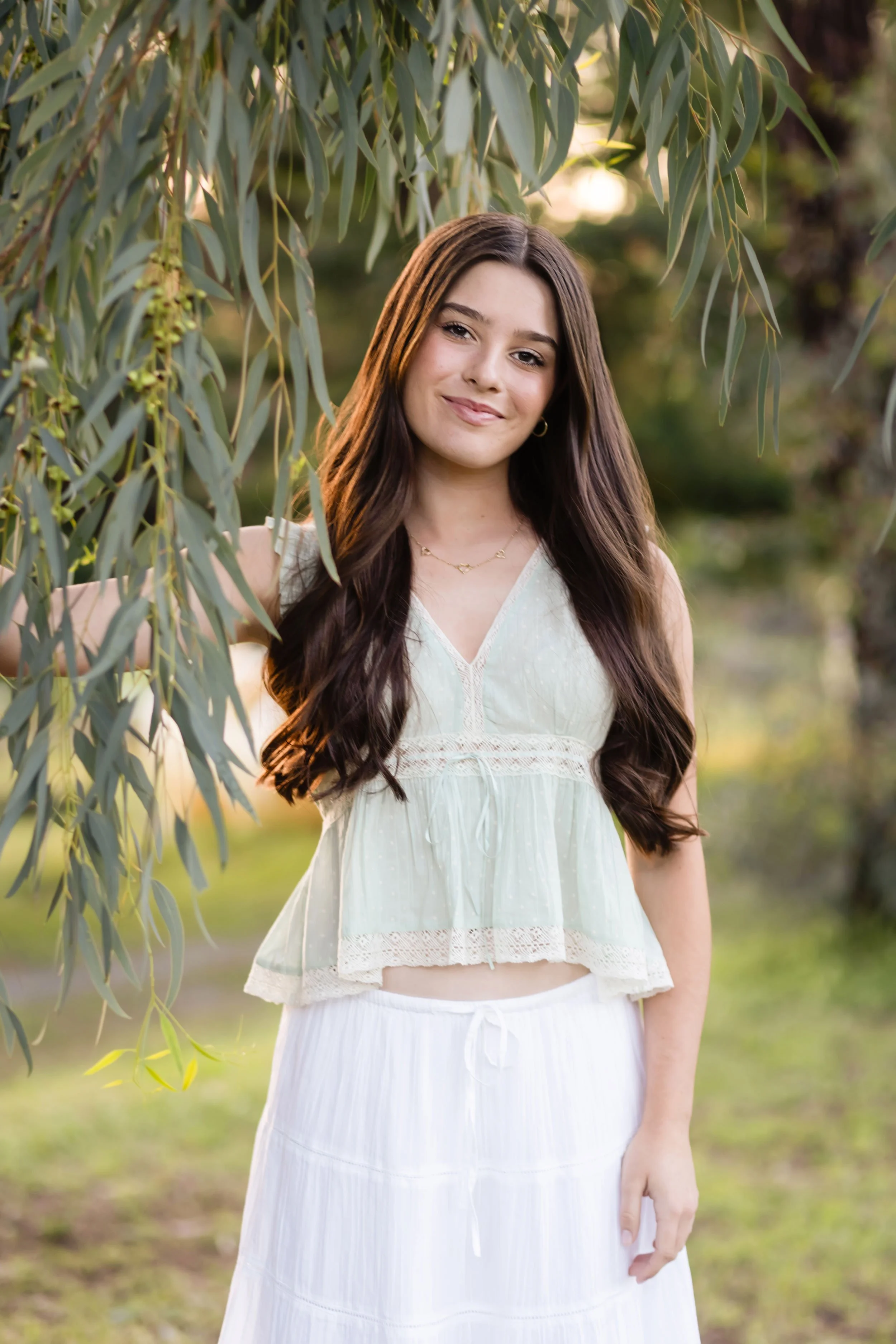 Antelope High School Senior Sydney poses next to a tree at Bywater Hollow Lavender Farm in the spring of 2026