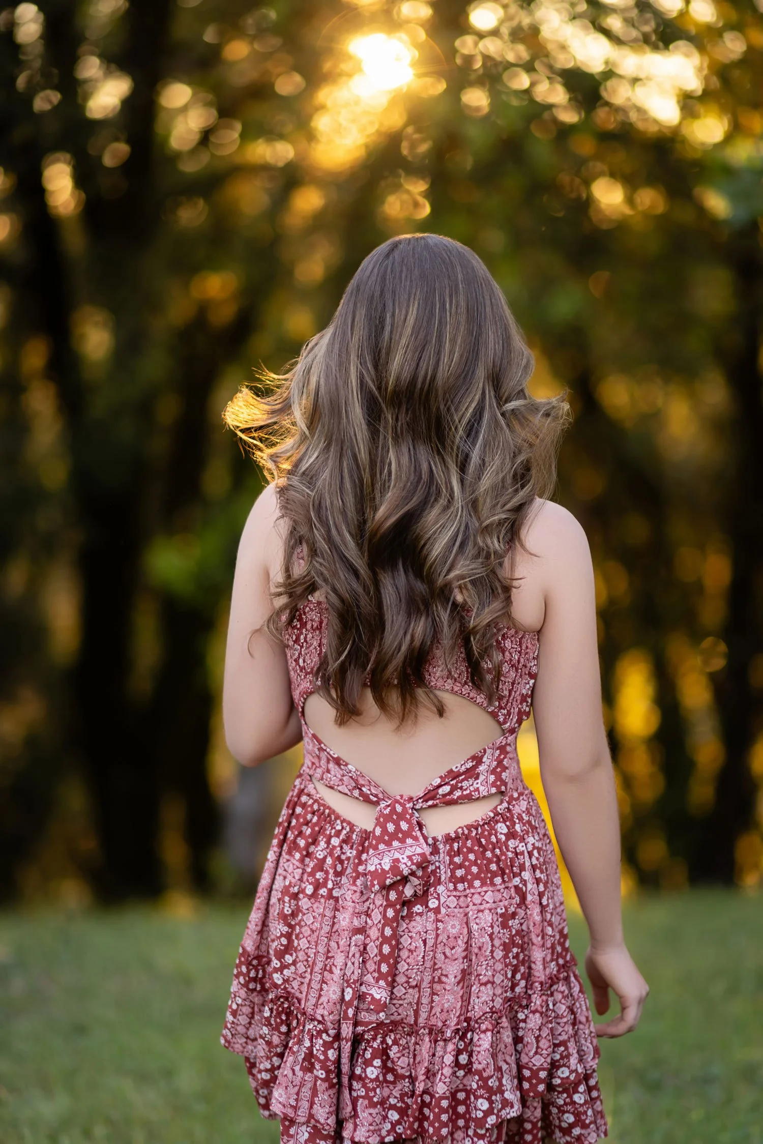 Weimar Hills school graduation photos in a field with the setting sun in Colfax, California