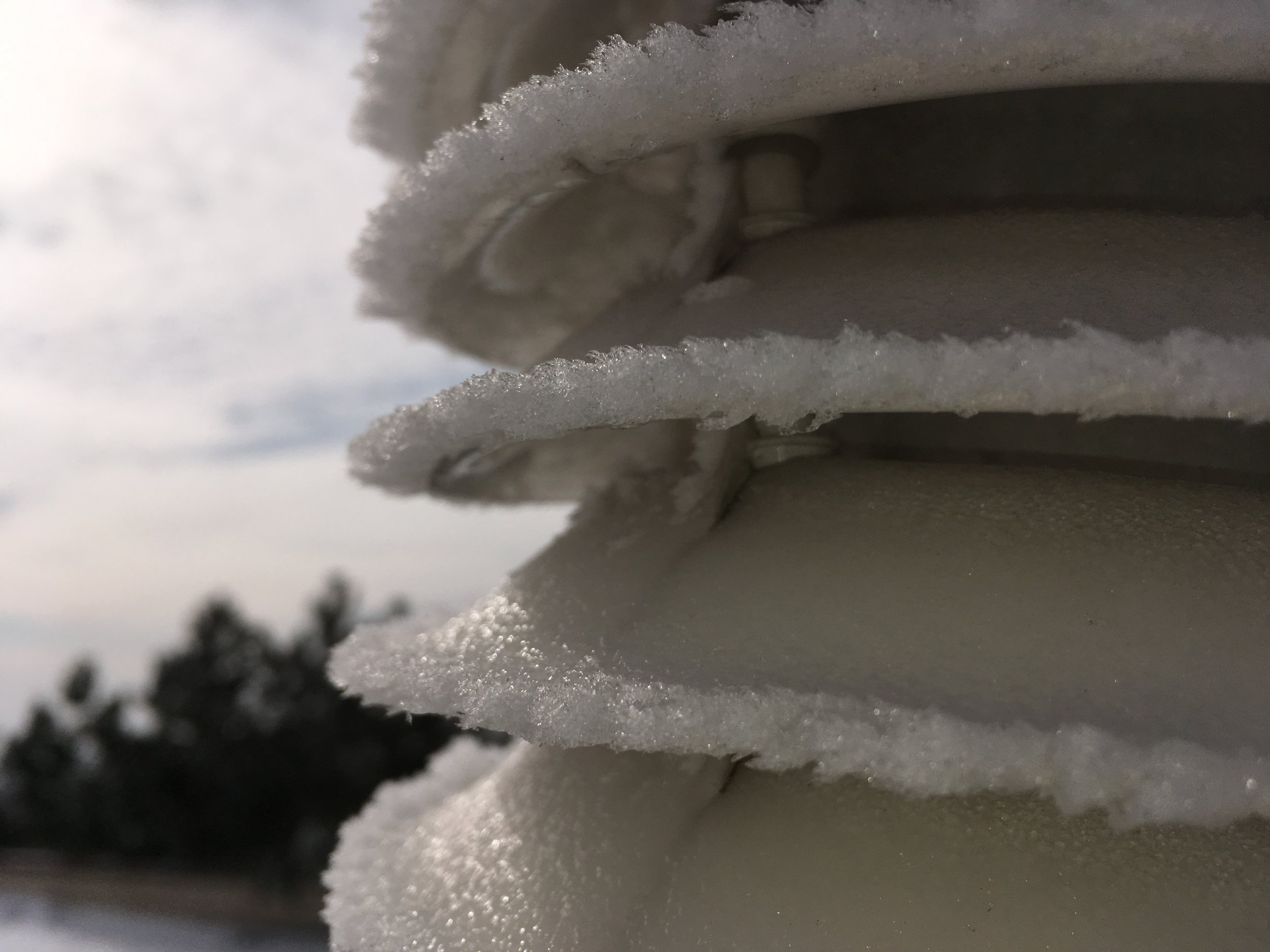 Icing glimmering in the sun on the MeteoShield solar radiation shield