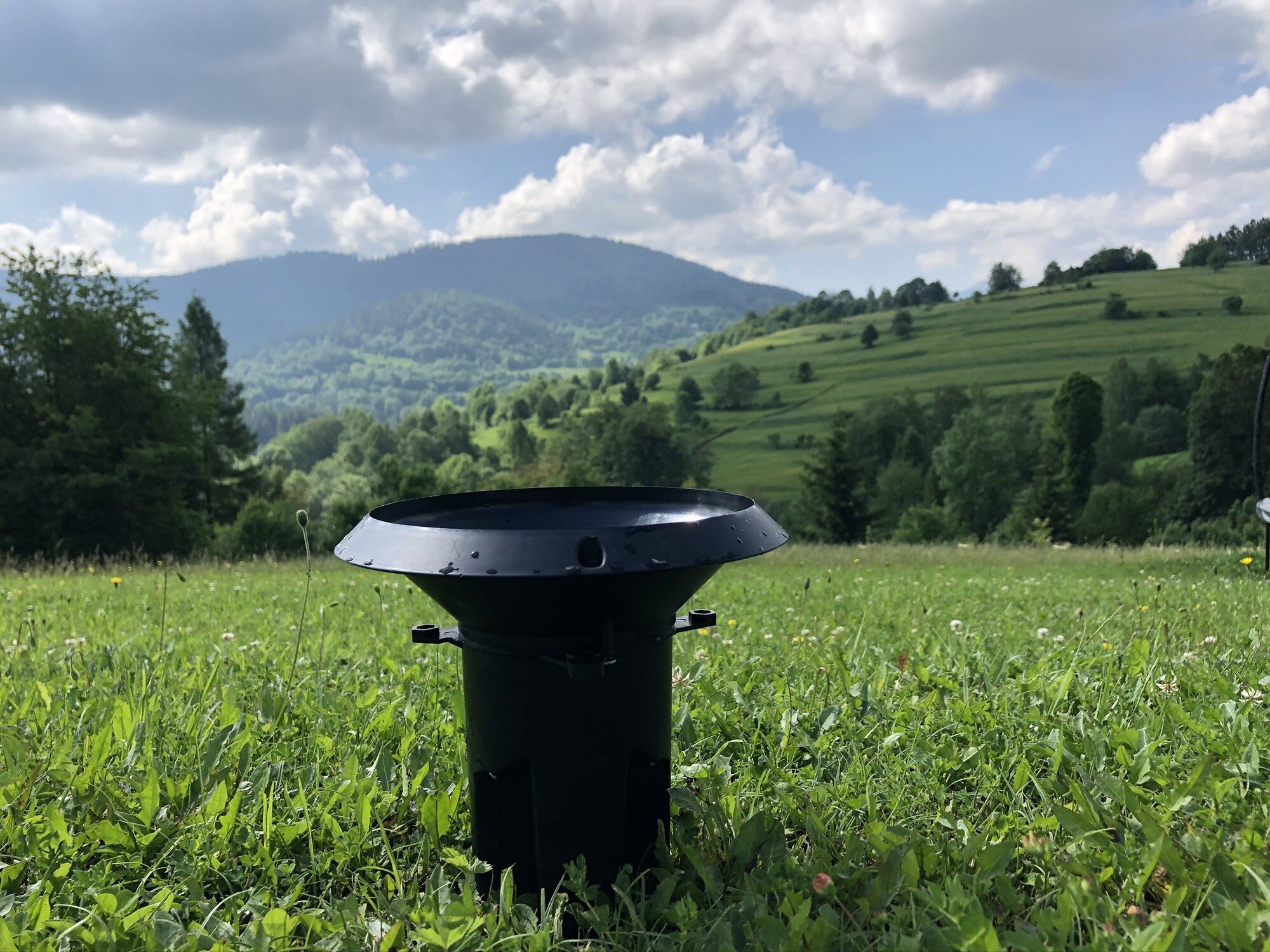 MeteoRain rain gauge overlooking a valley