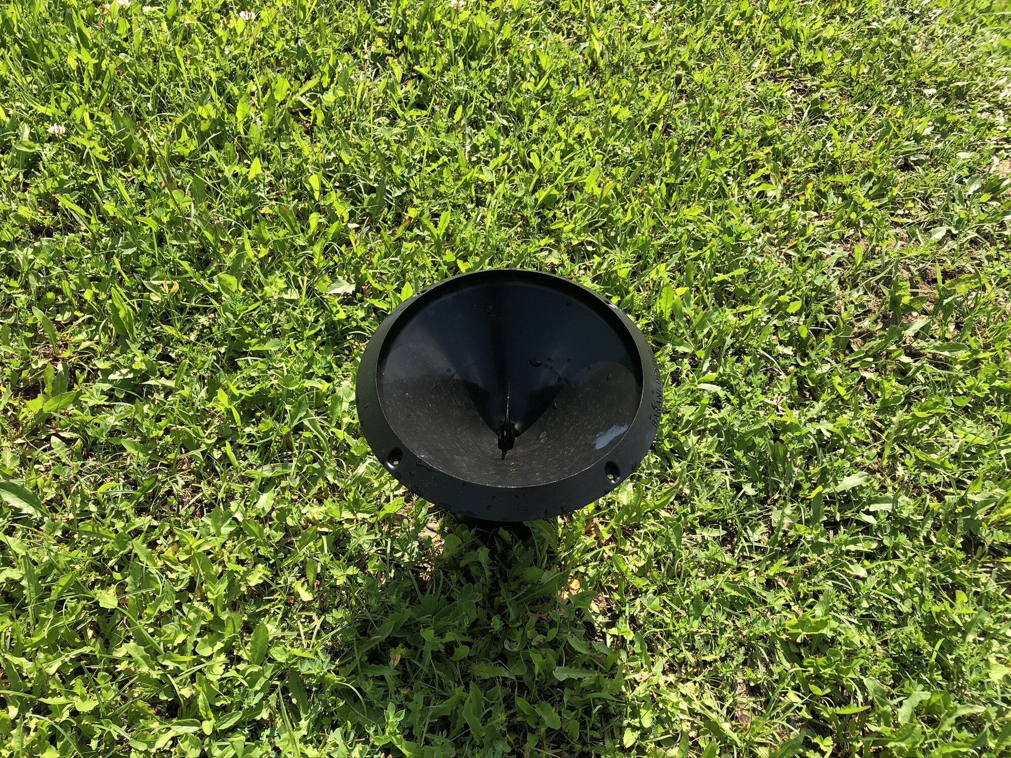 MeteoRain 200 Compact rain gauge top view on a golf course